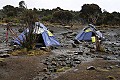 This was our camp site for the second night on Kili.<br />Our tent is the one on the left with a pair of trekking poles hanging in front.<br />Wet and miserable just like all the other camp sites  on the way up.